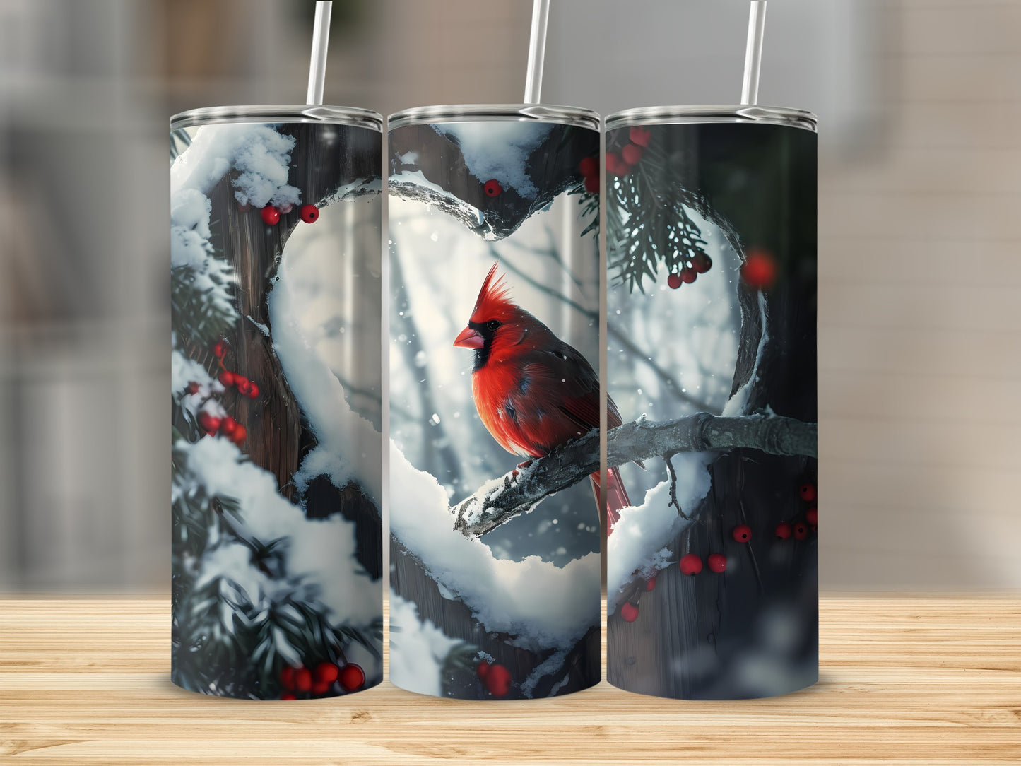 Three tumblers featuring a cardinal perched on a snowy branch within a heart-shaped opening.
