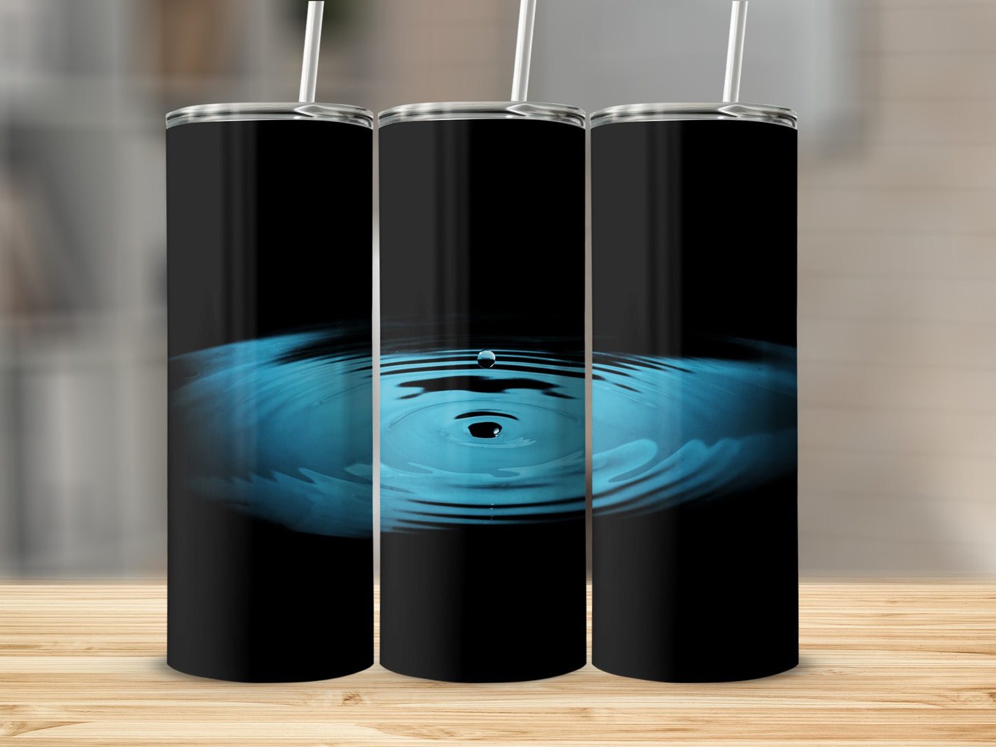 Black tumbler with rippling blue water effect and white straw.