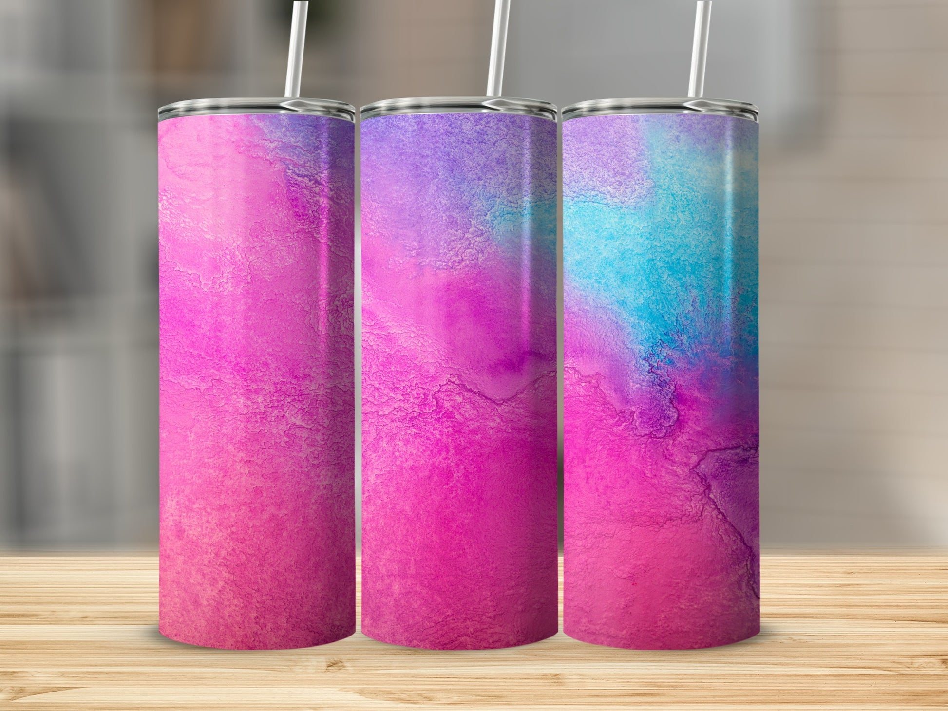 Three tumblers with a pink, purple, and blue abstract watercolor design.