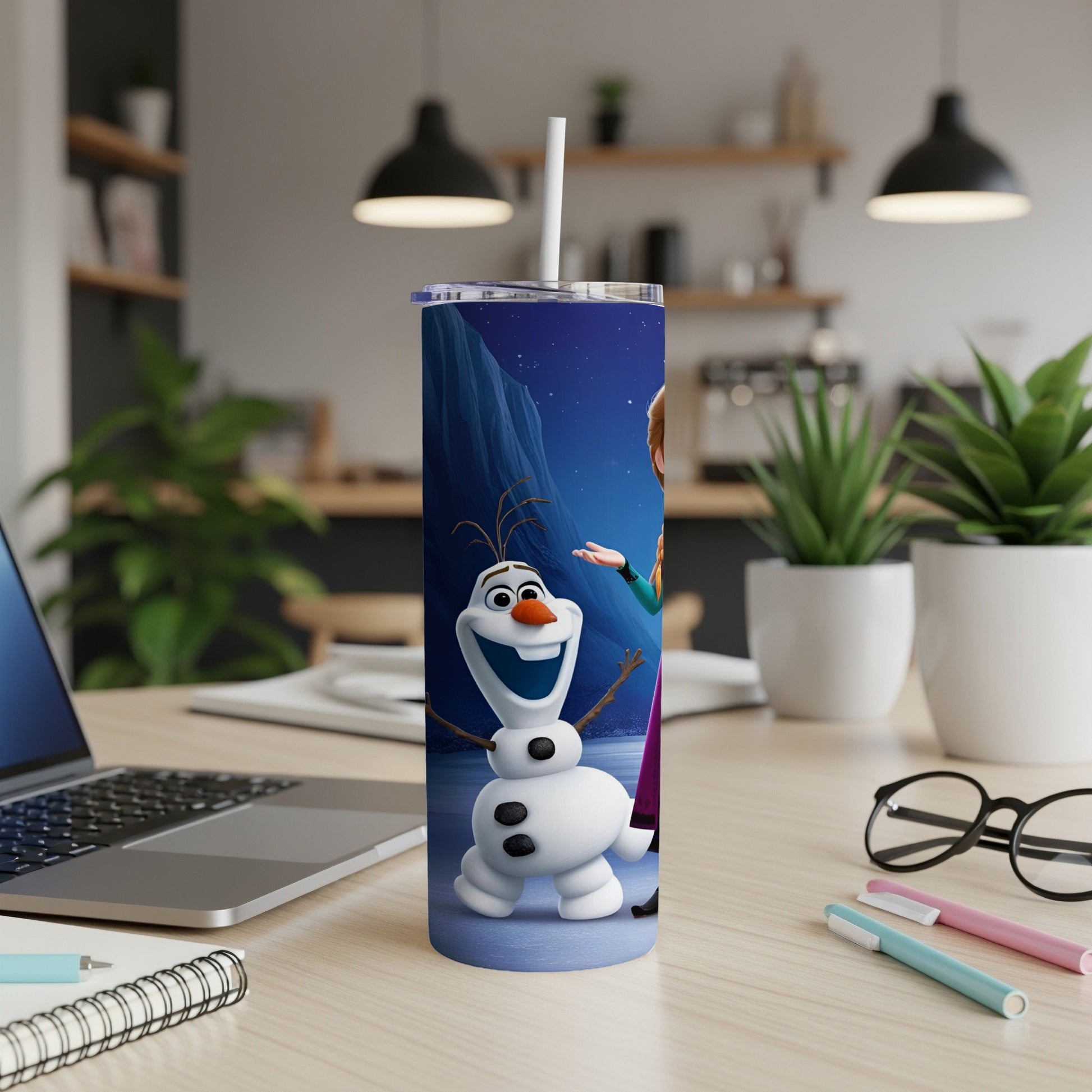 Olaf and Anna from Frozen on a blue insulated tumbler with a straw.
