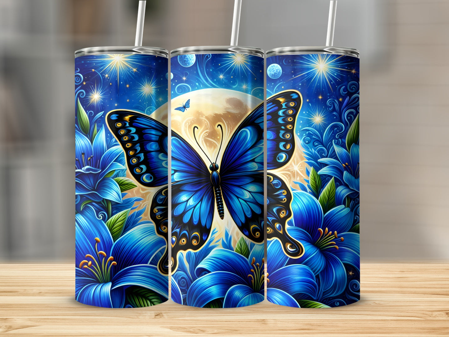 Three tumblers featuring a blue butterfly and lilies against a moonlit sky.