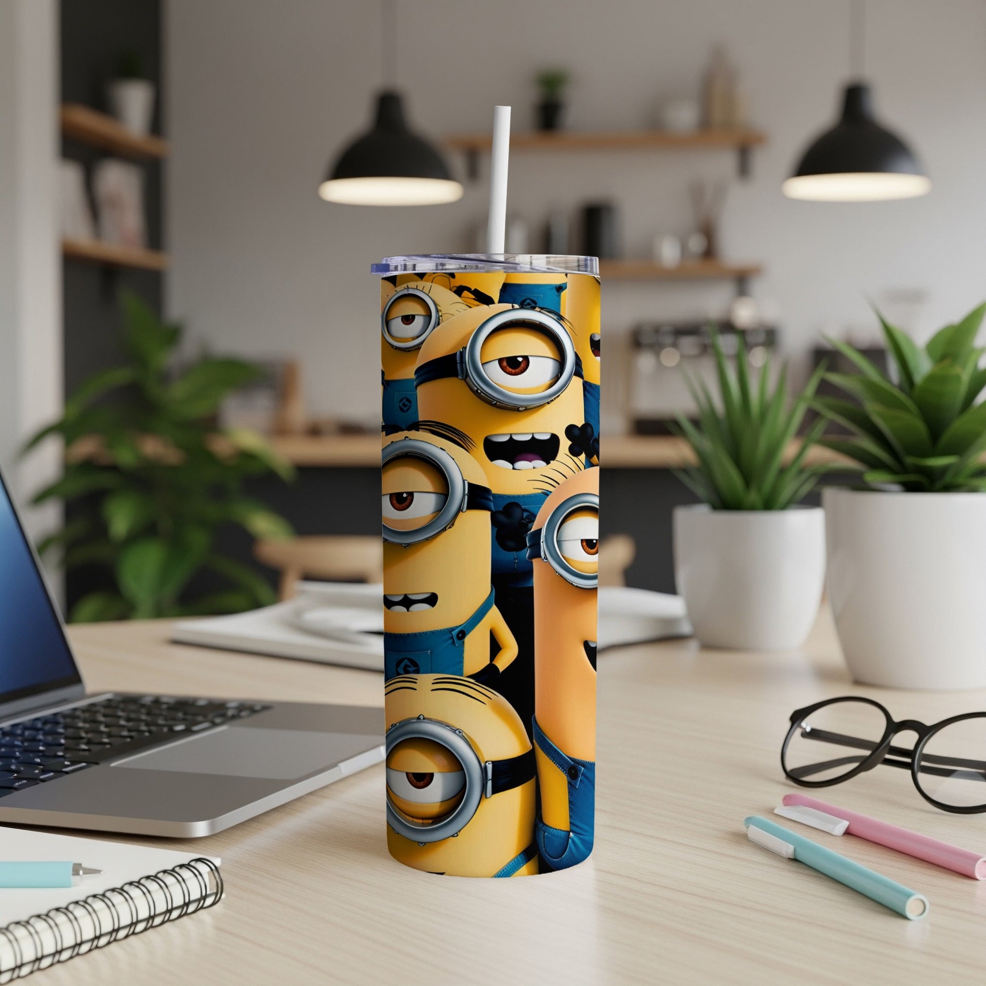 Yellow Minions characters on a stainless steel tumbler with straw.