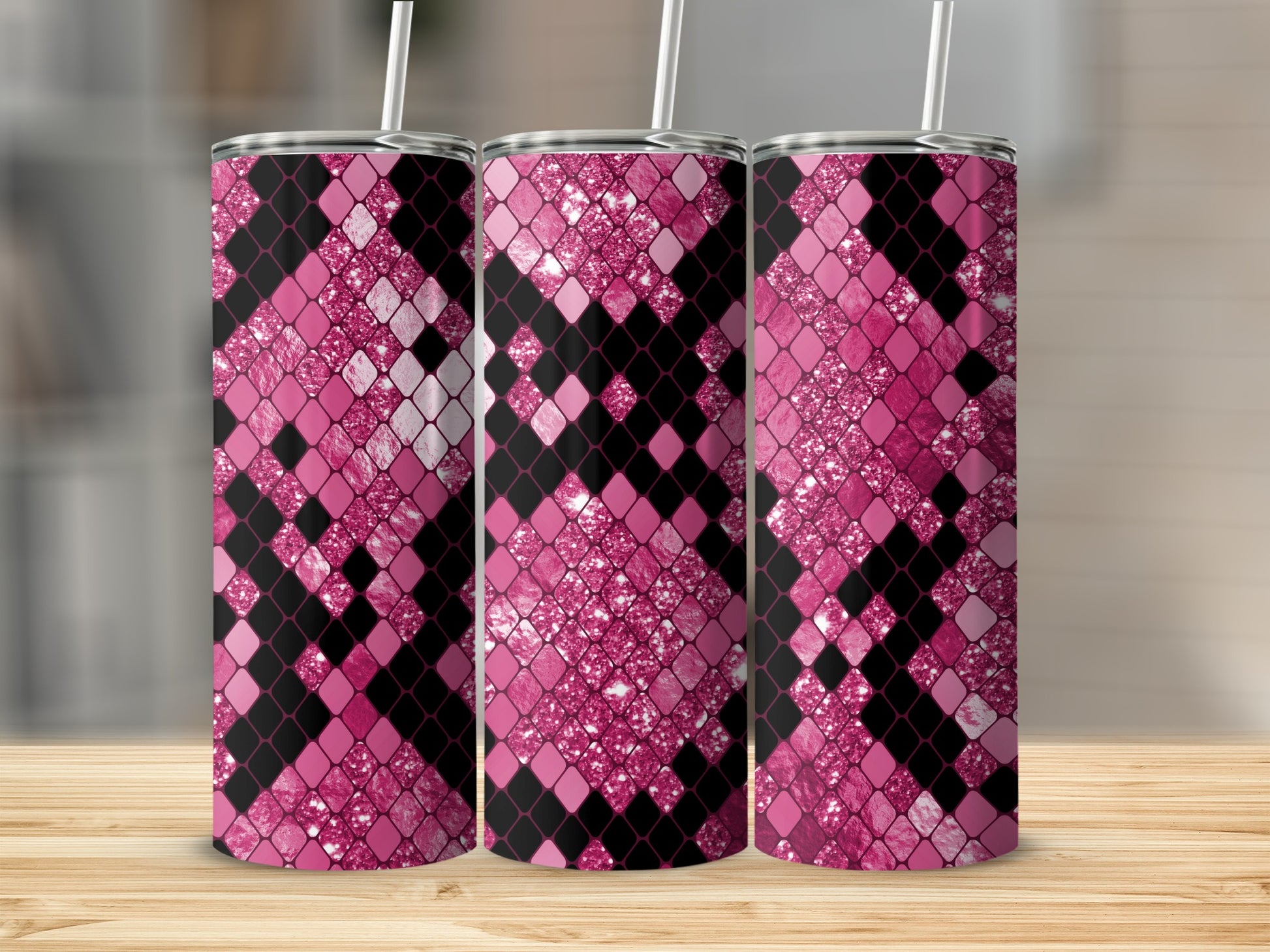 Three tumblers with pink and black diamond-shaped snake skin pattern and glitter.