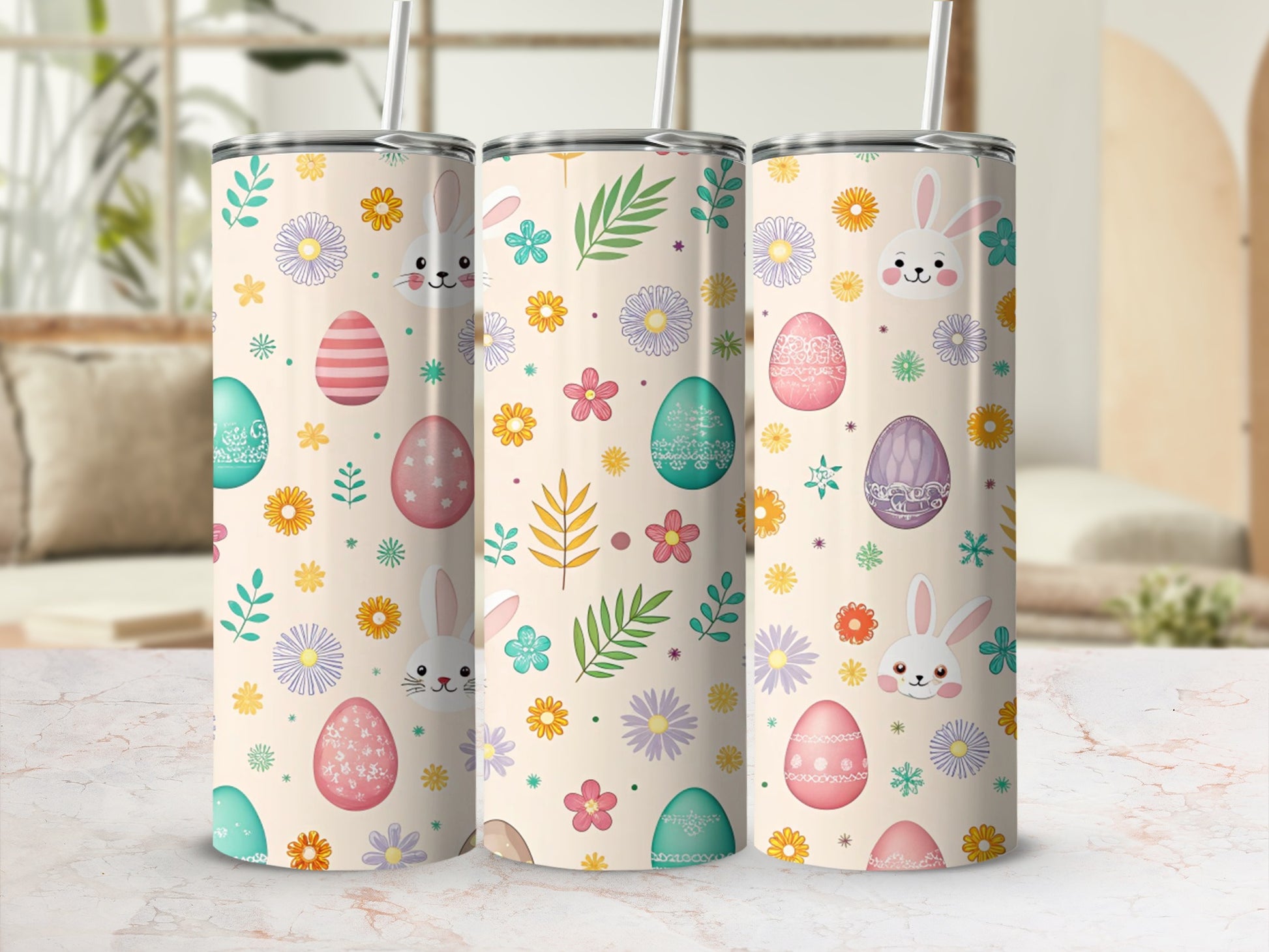 Three tumblers with Easter eggs, bunnies, and floral designs.