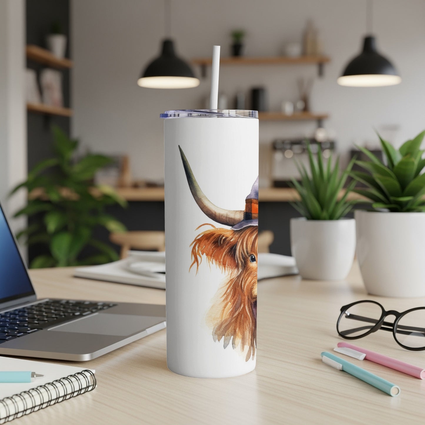 Highland cow wearing a Viking helmet on a white tumbler.