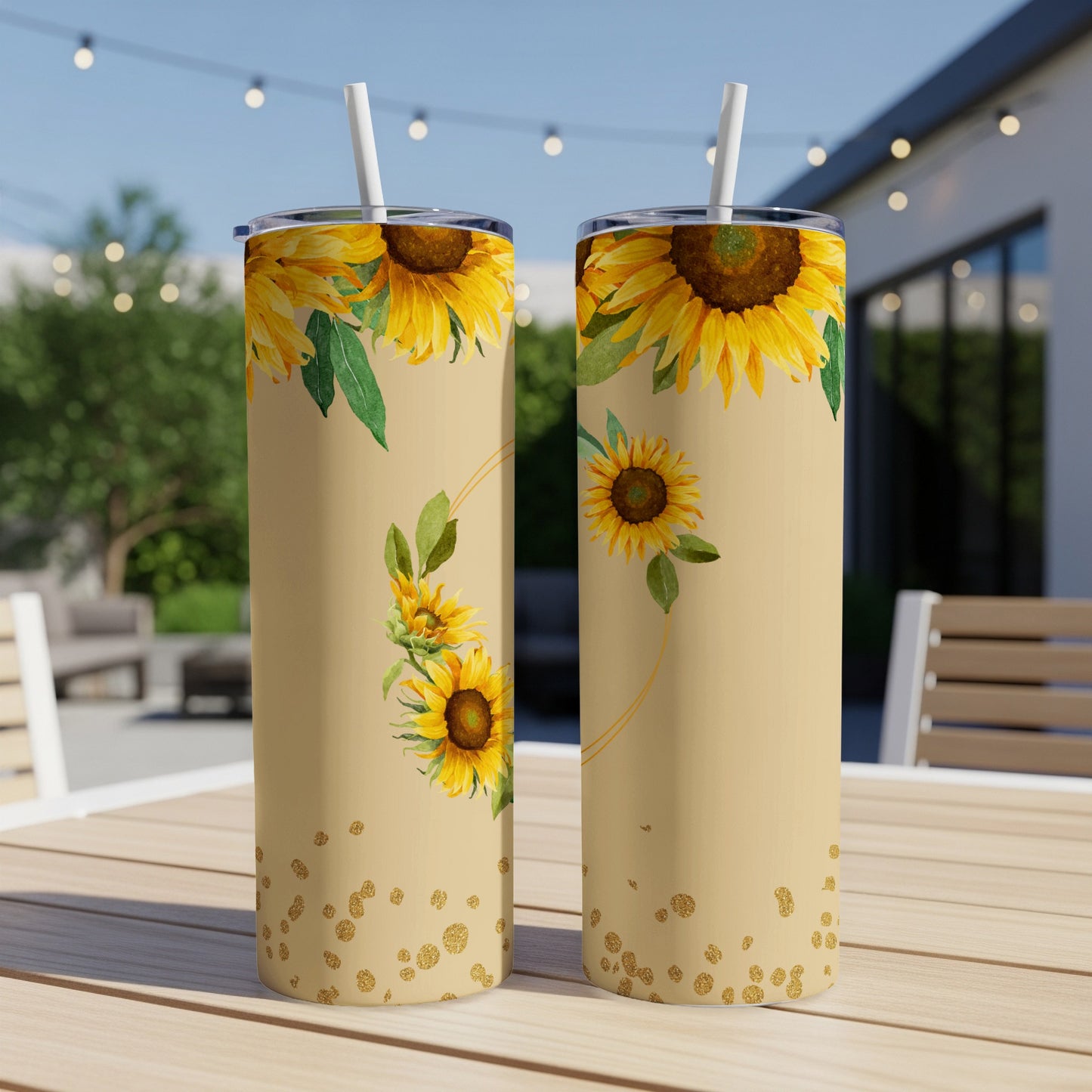 Tall tumblers with sunflowers and gold glitter on a light tan background.