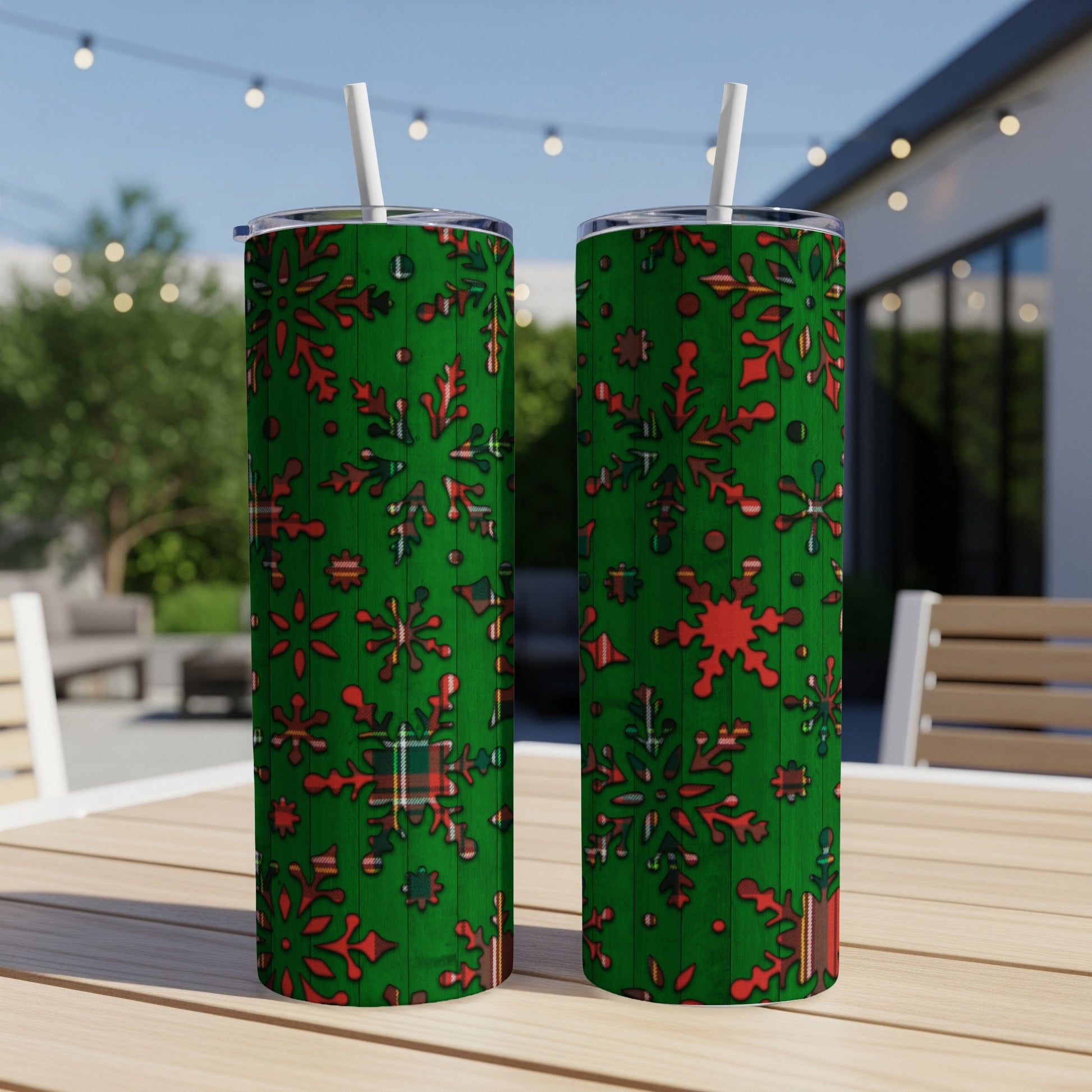 Green tumblers with red plaid snowflake pattern and white straws.