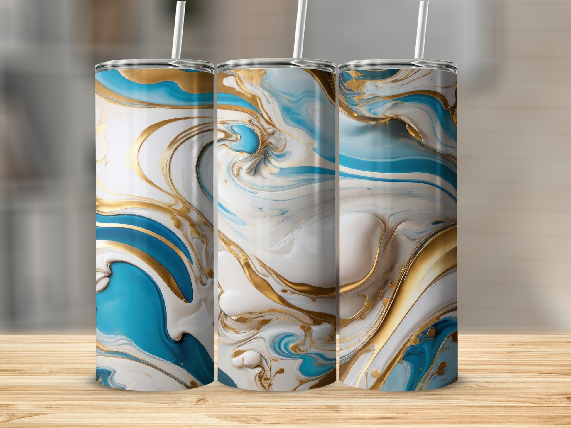 Three tall tumblers with white, gold, and blue marbled swirling designs.