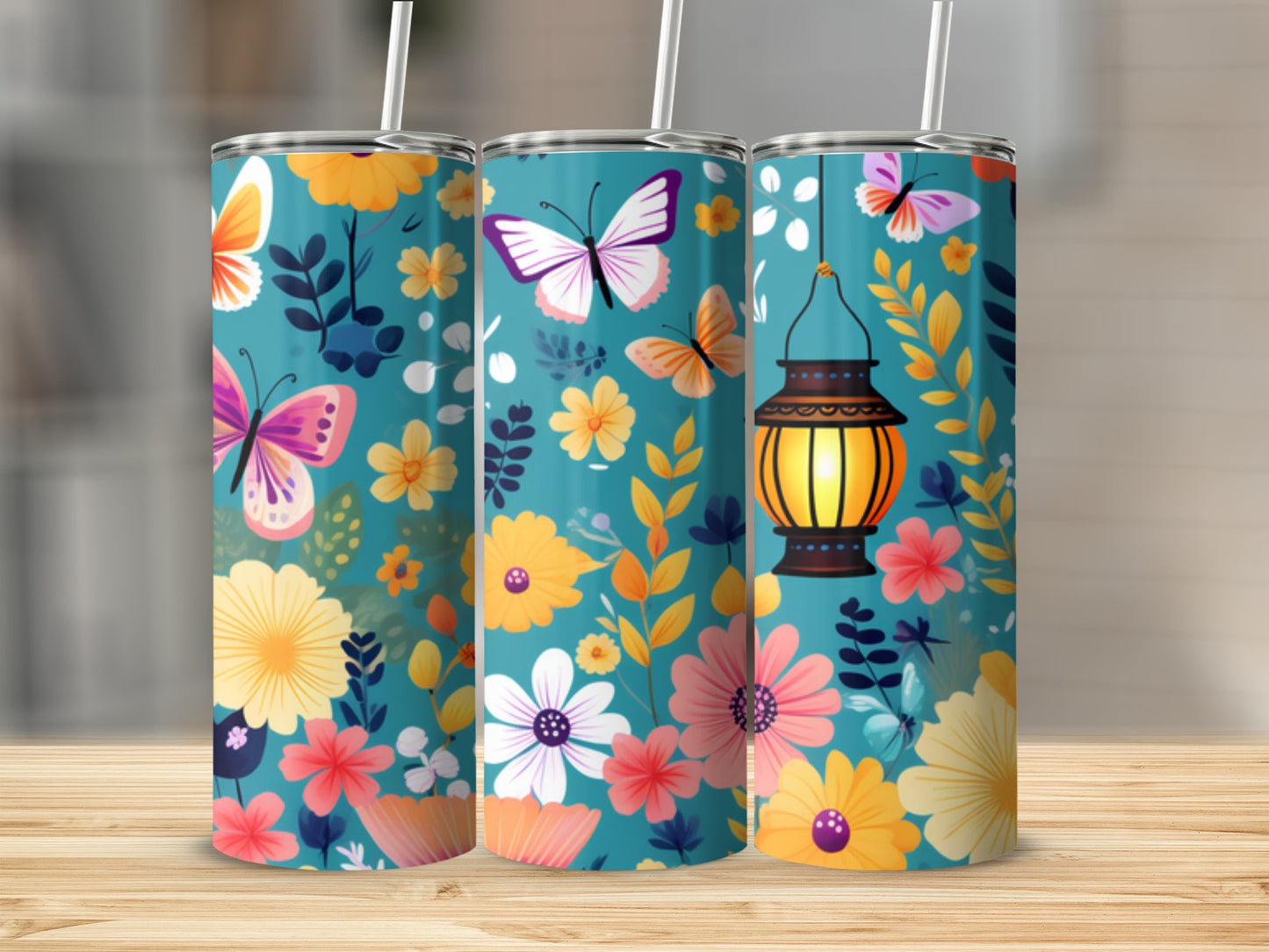Turquoise tumbler with butterflies and floral designs.