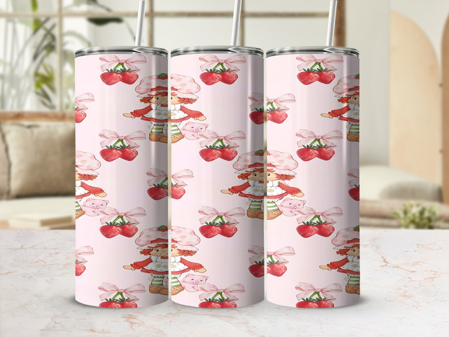 Pink tumbler with repeating pattern of Strawberry Shortcake characters and bows.