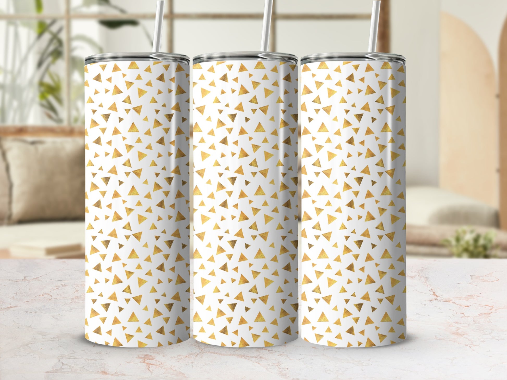 Three tumblers with a white background and scattered gold triangle pattern are displayed.