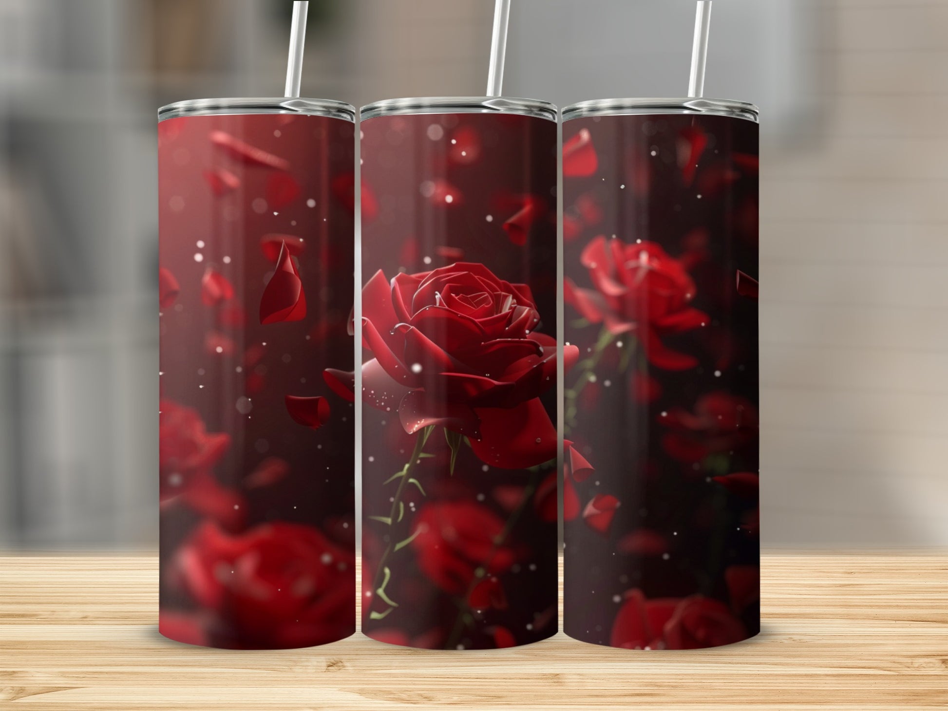 Three tumblers with red rose and petal design.