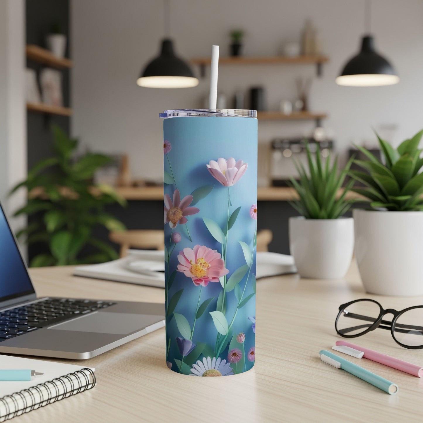 Blue tumbler with pink and purple wildflowers and greenery.