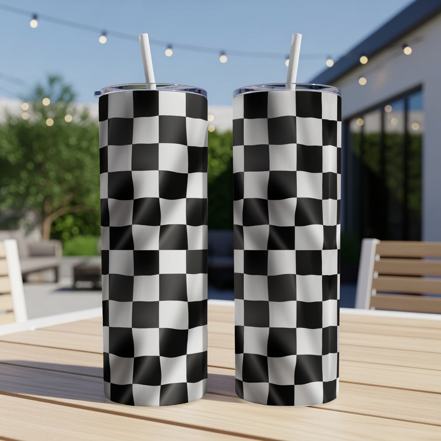 Two tumblers with black and white checkered racing flag pattern.