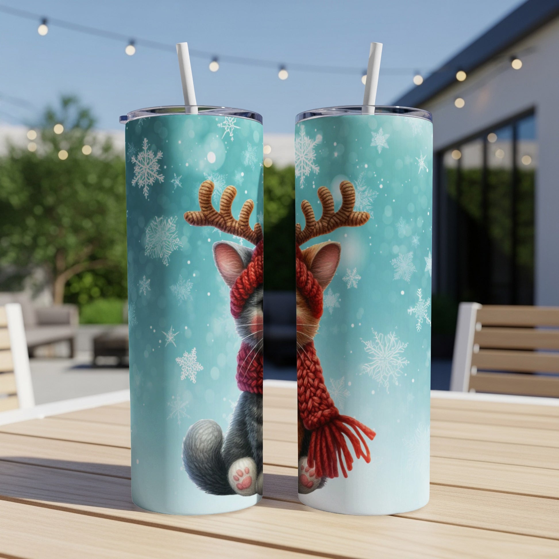 Two tumblers with a Christmas cat wearing a reindeer headband and scarf.