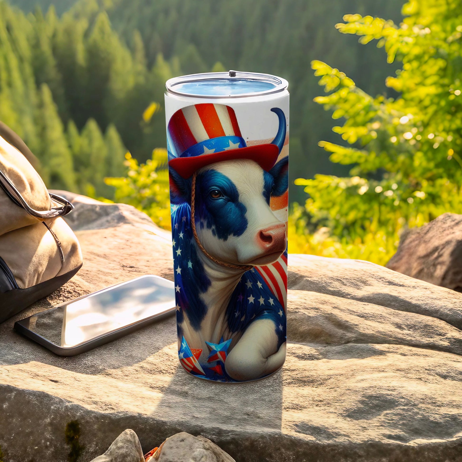 Cow wearing American flag hat and bandana on patriotic tumbler.