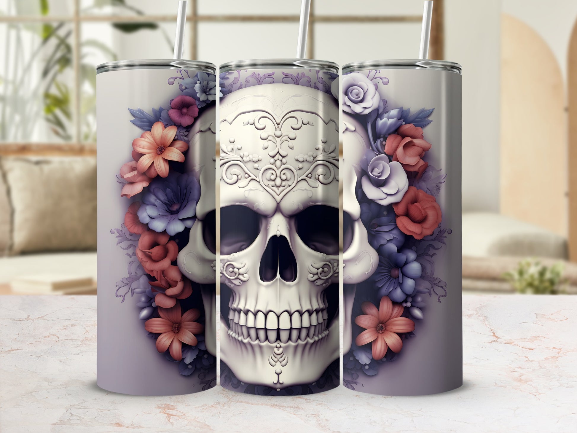 Floral skull tumbler with straws on a marble countertop.
