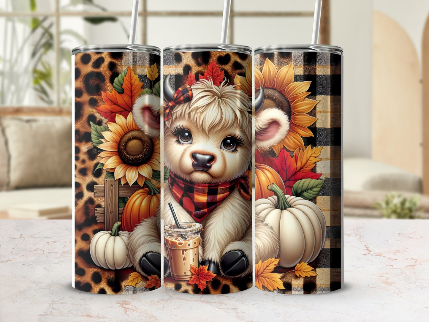 Three tumblers with a cartoon cow, pumpkins, sunflowers, and leopard print.