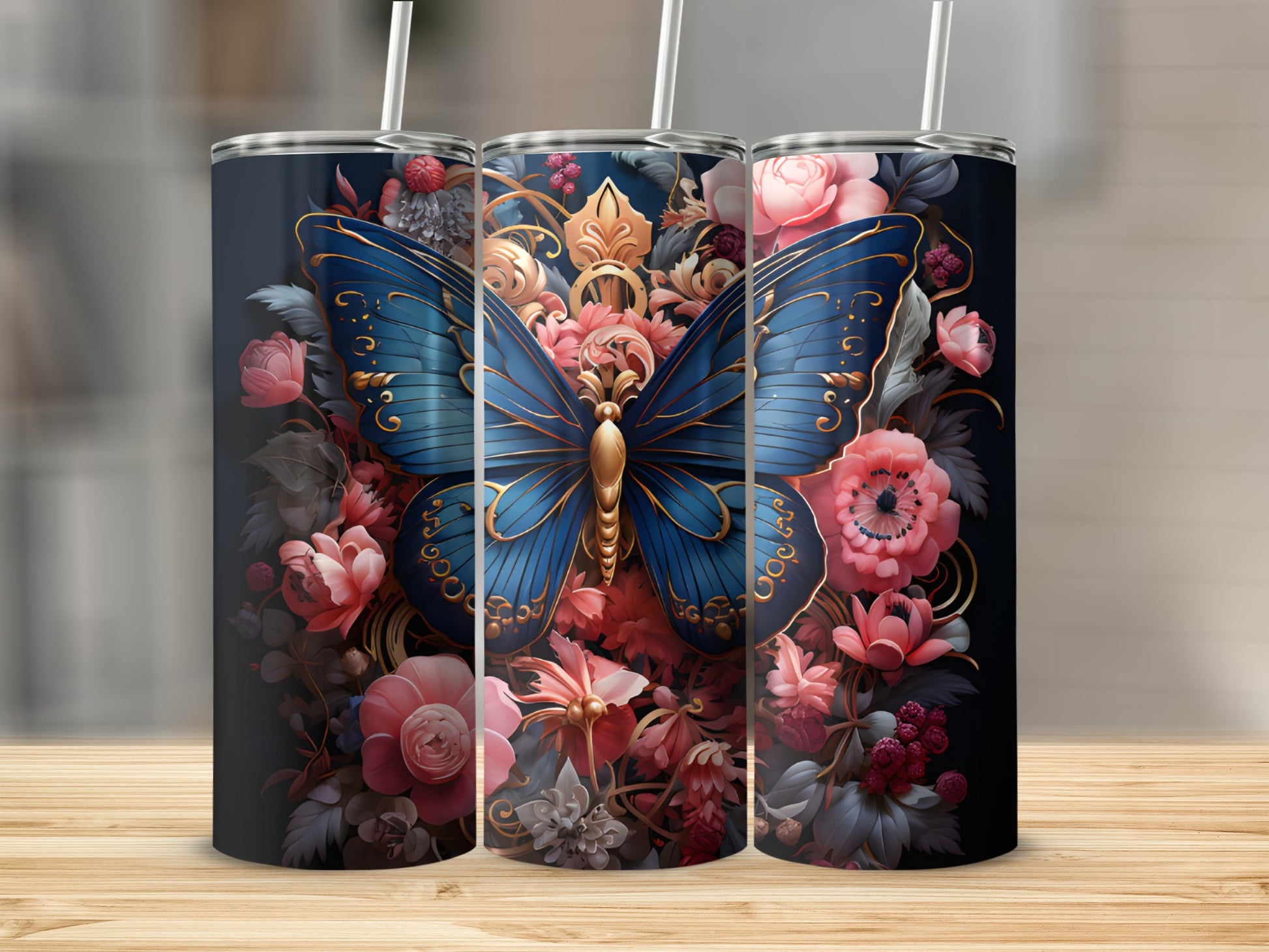Three tumblers featuring a blue butterfly with ornate gold details and floral accents.