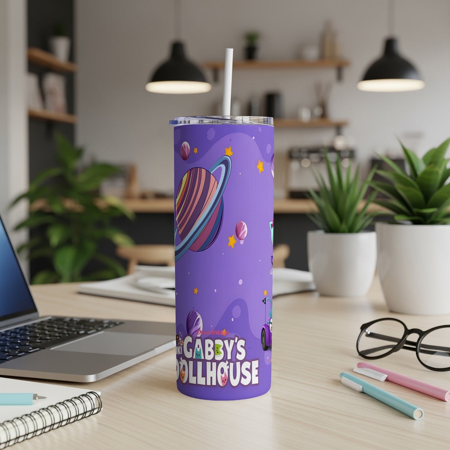Purple tumbler with Gabby's Dollhouse characters and logo.
