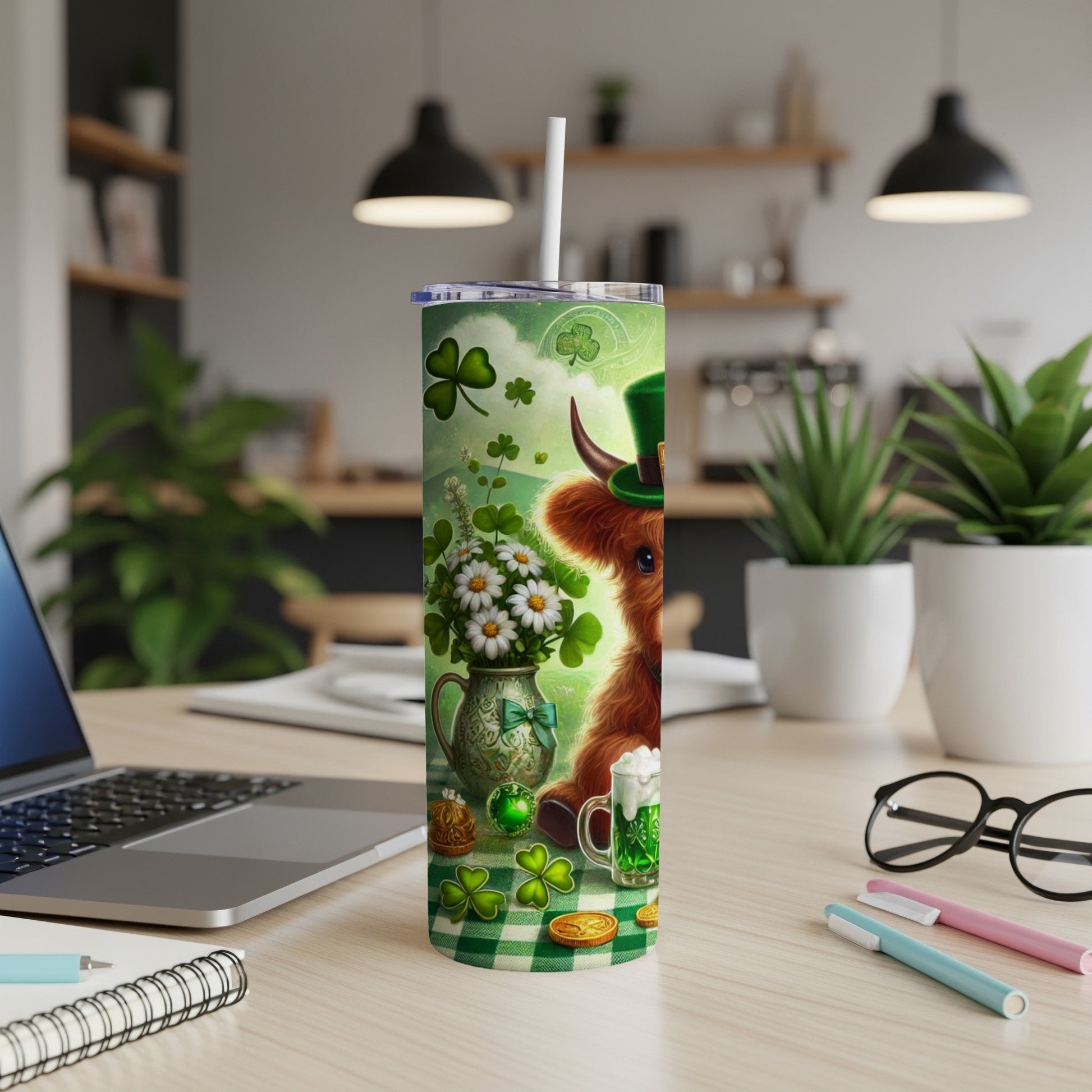 Highland cow in St. Patrick's Day hat with shamrocks and daisies on a tumbler.