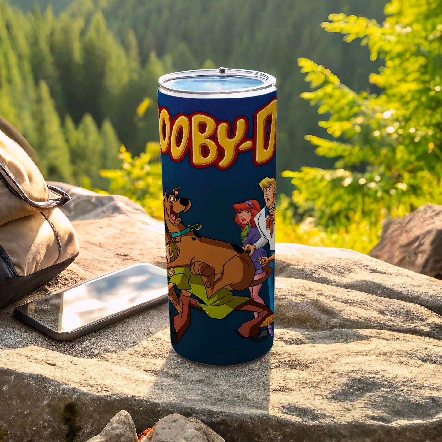 Scooby-Doo characters on a blue tumbler with a forest background.