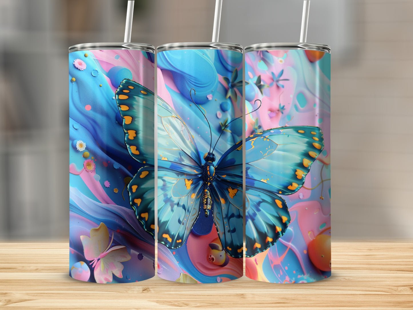 Three tumblers with blue butterfly and floral watercolor designs.
