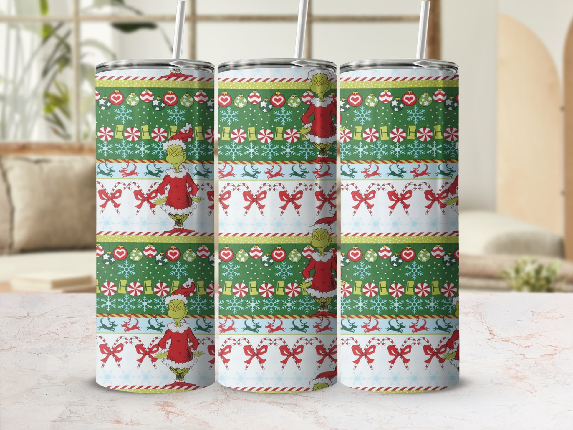 Green Grinch Christmas tumbler with snowflakes and candy canes.