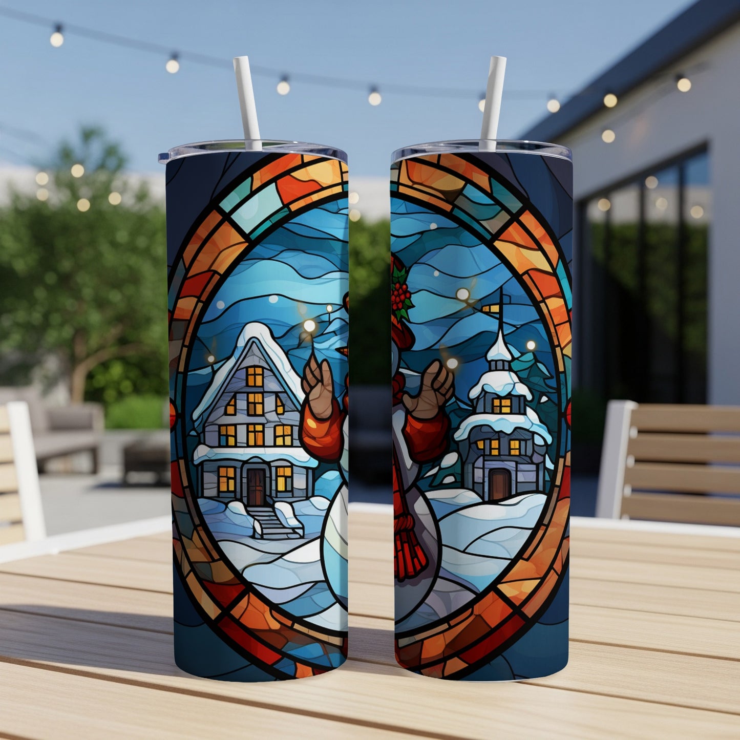 Two tumblers featuring stained glass art of a snowman and winter village.