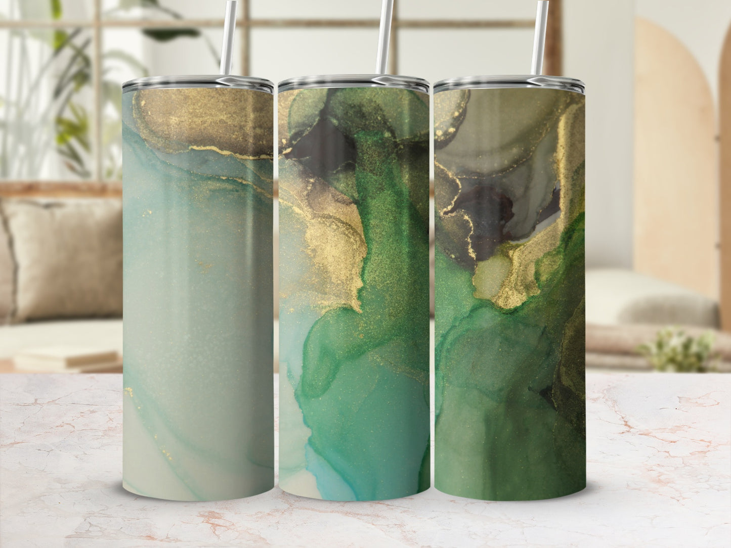 Three tumblers with swirling green and gold abstract designs.