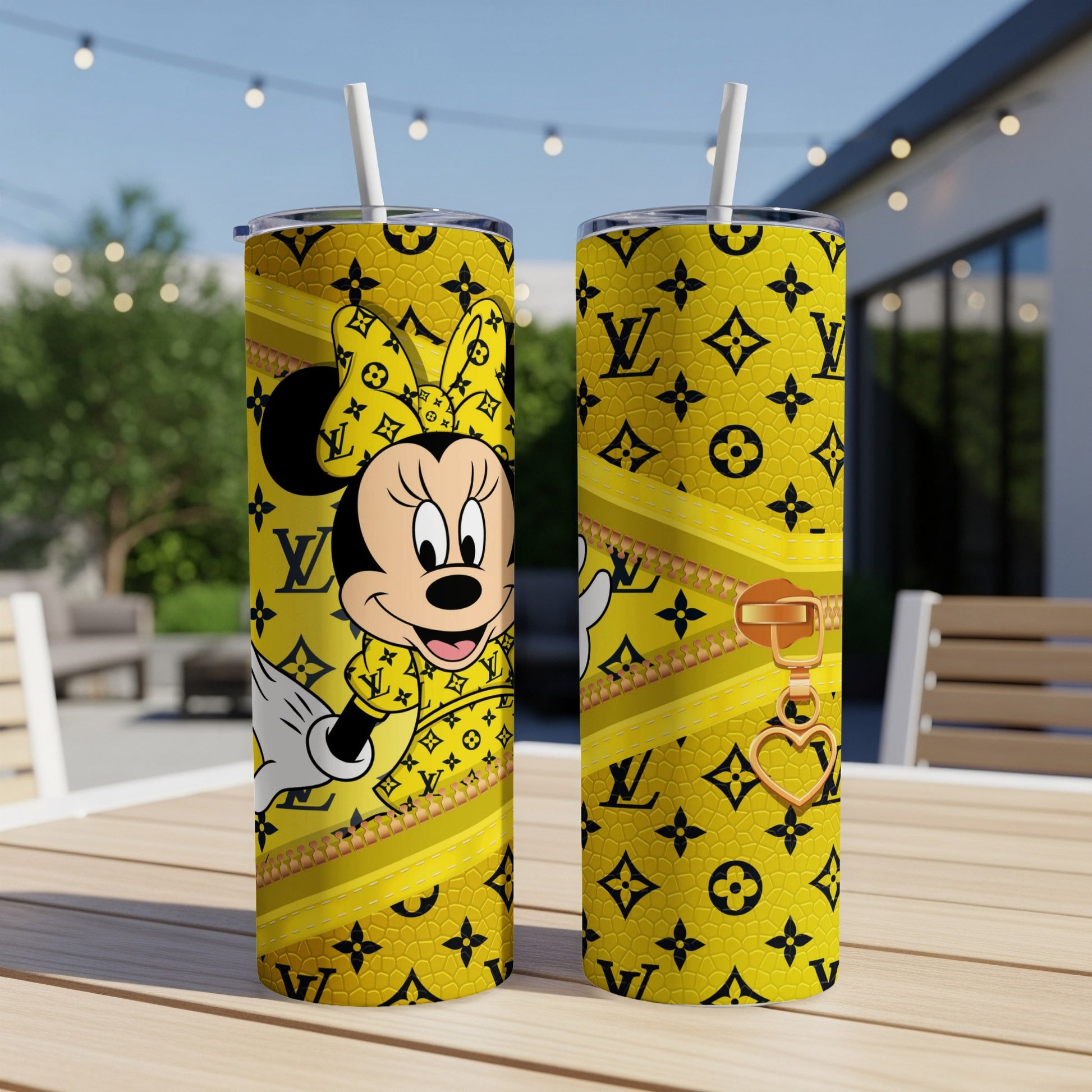 Yellow Minnie Mouse tumbler with Louis Vuitton pattern and gold zipper charm.