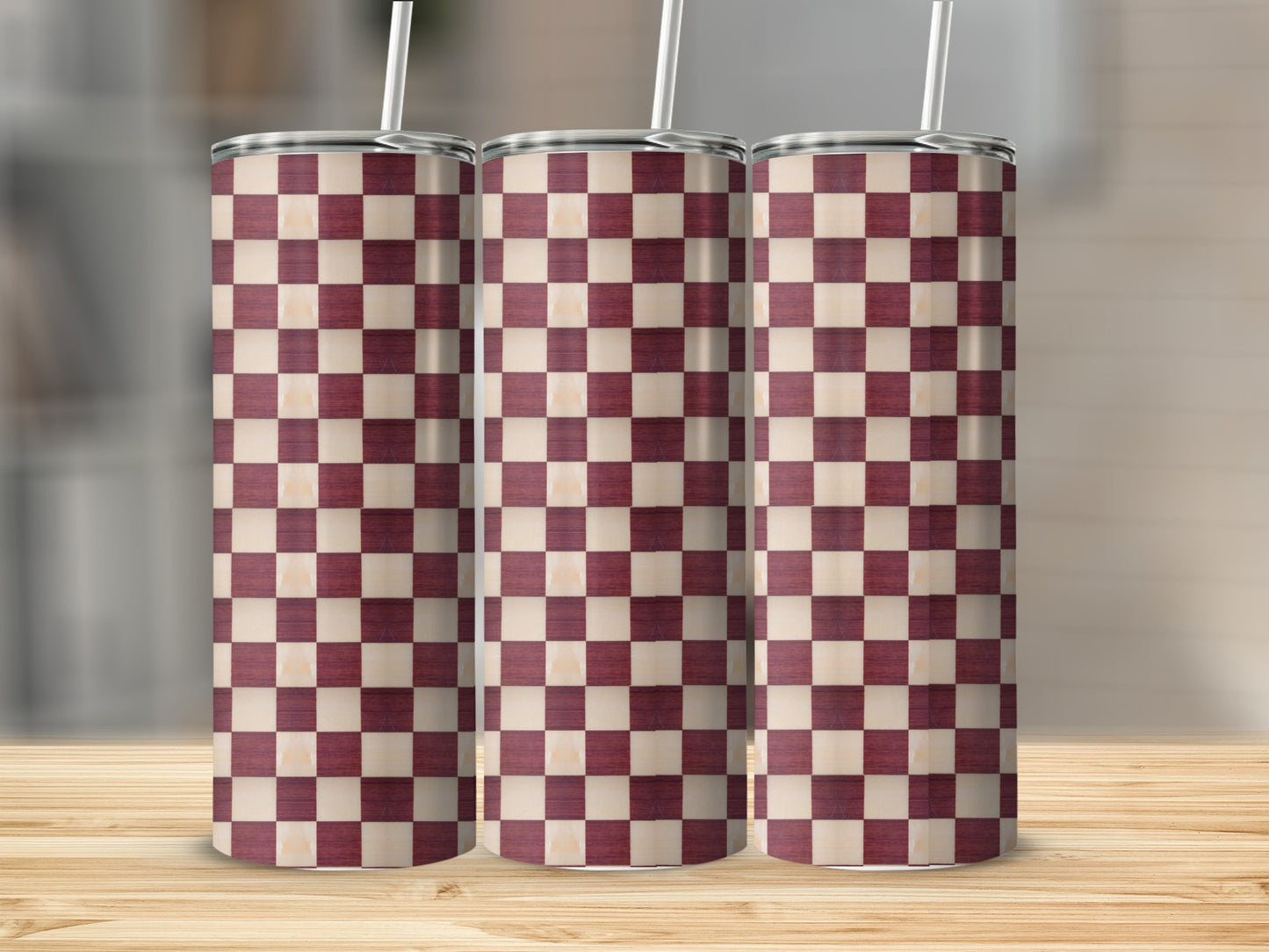 Three tall tumblers with a checkered maroon and cream pattern.