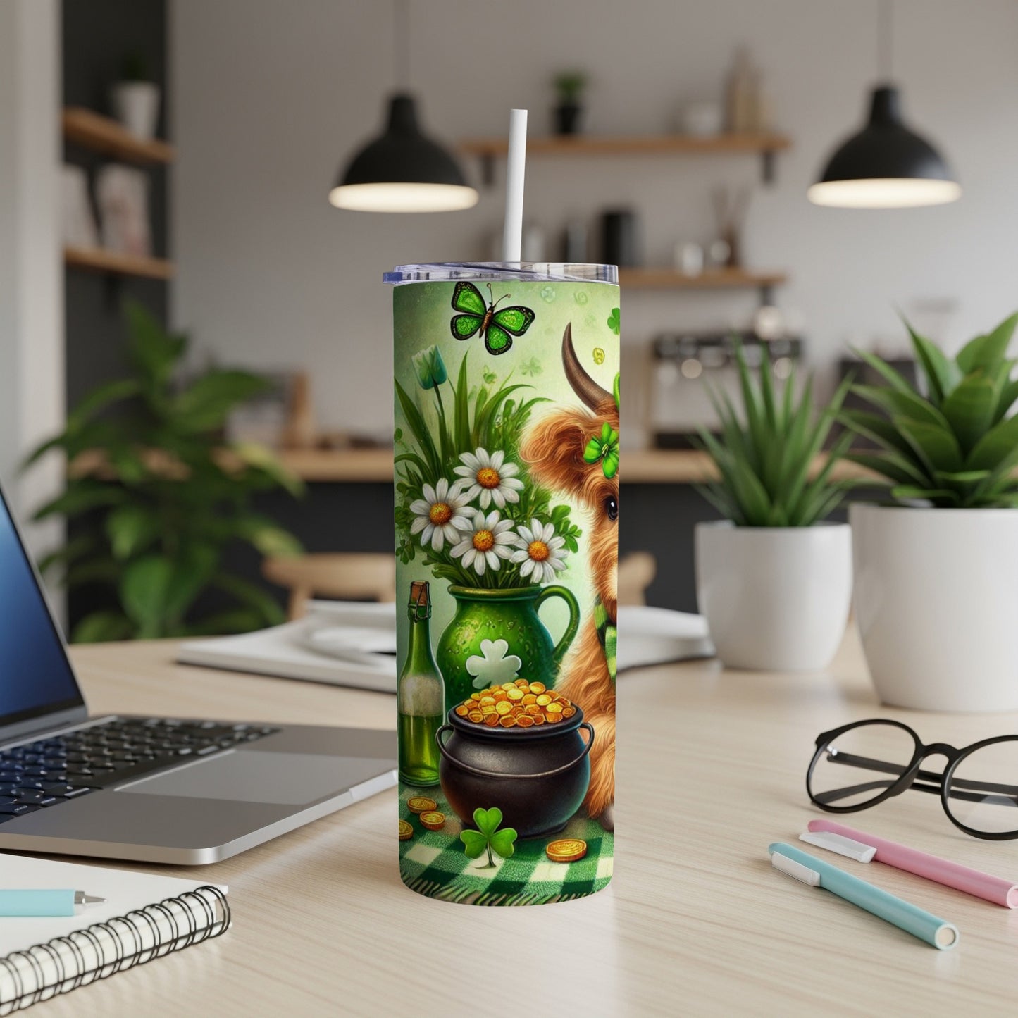 Highland cow with shamrocks and gold coins on a tumbler.