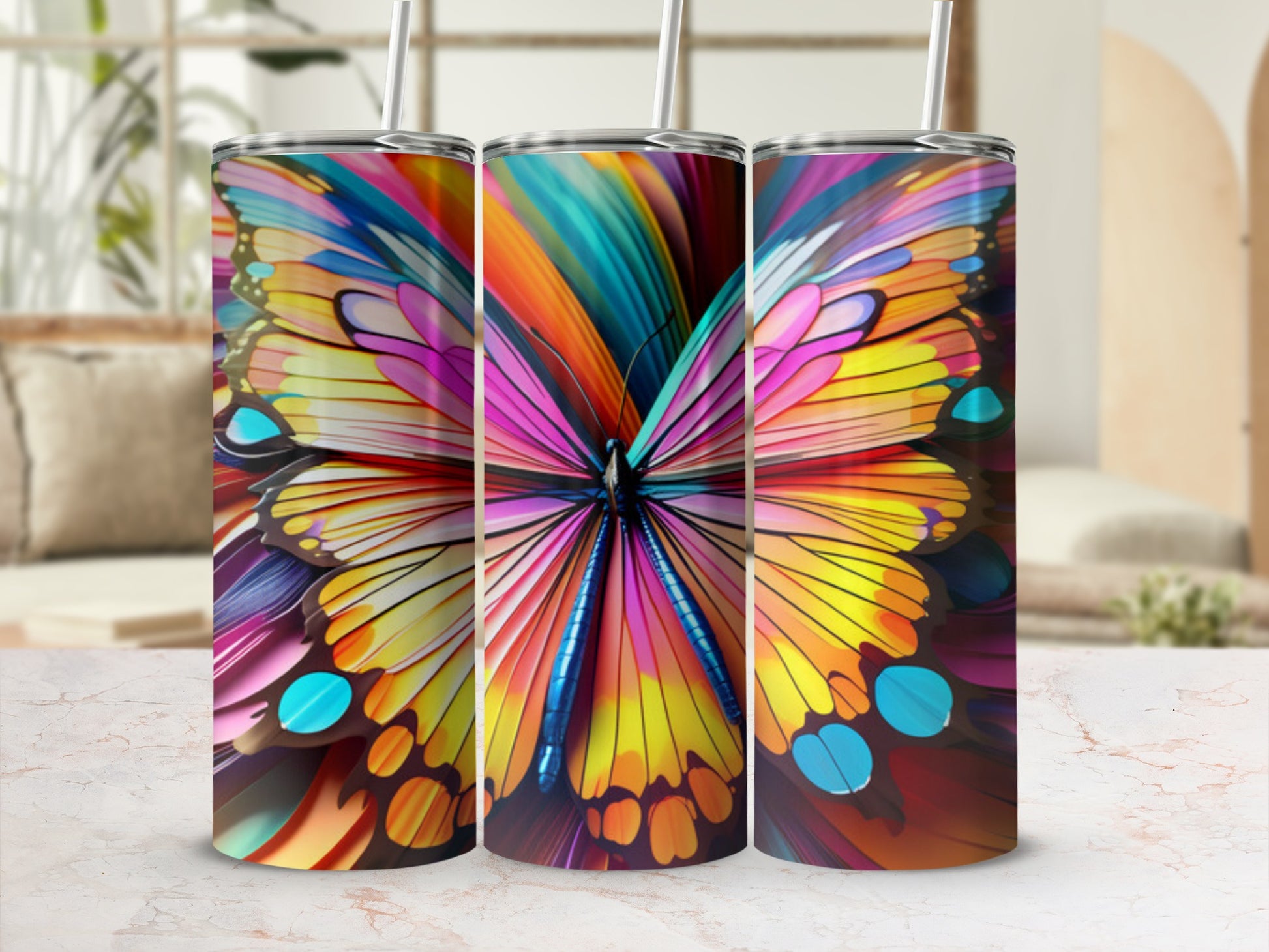 Colorful butterfly wings design on three tumblers.