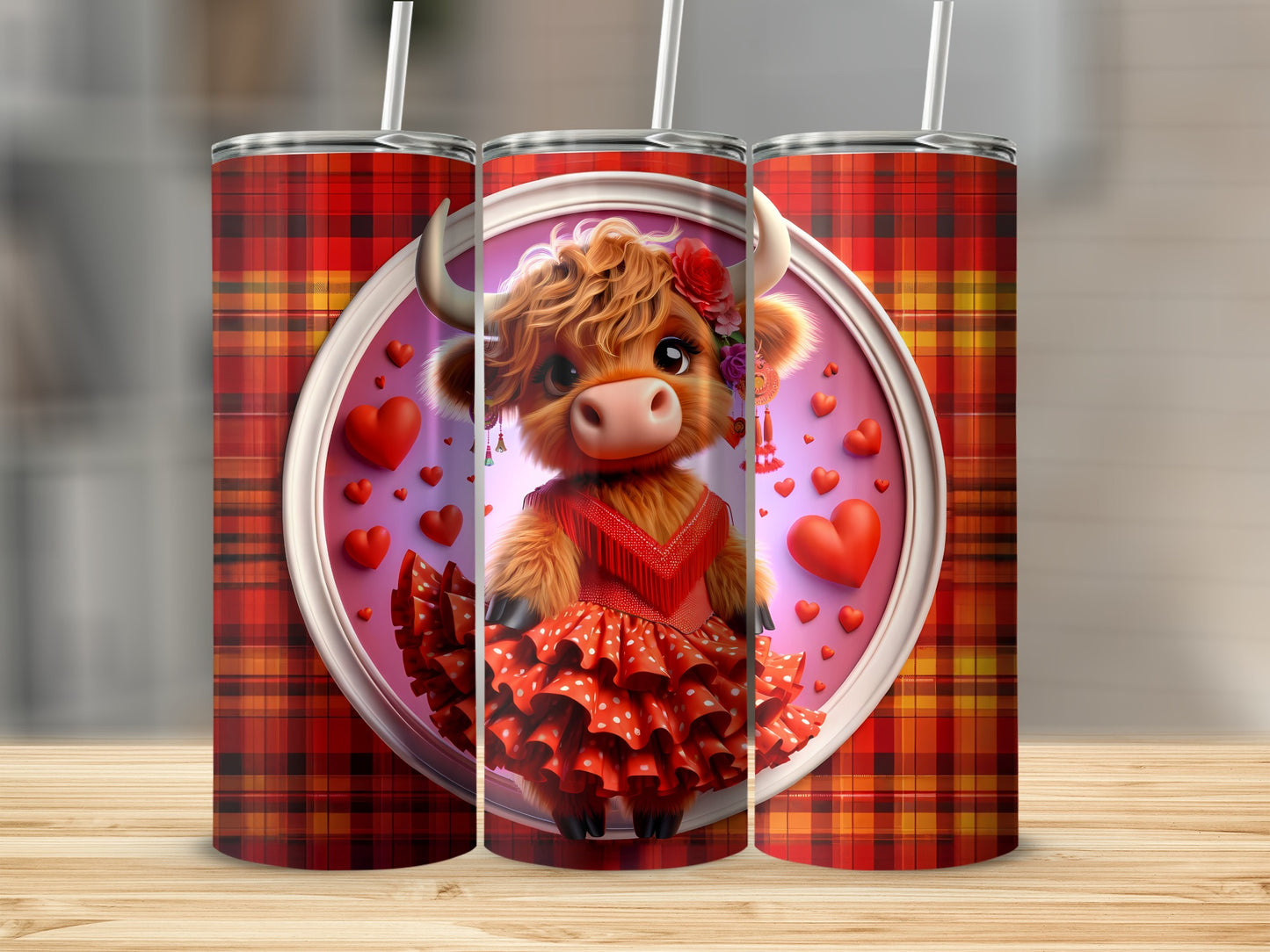Three plaid tumblers, one featuring a cartoon highland cow in a red dress.
