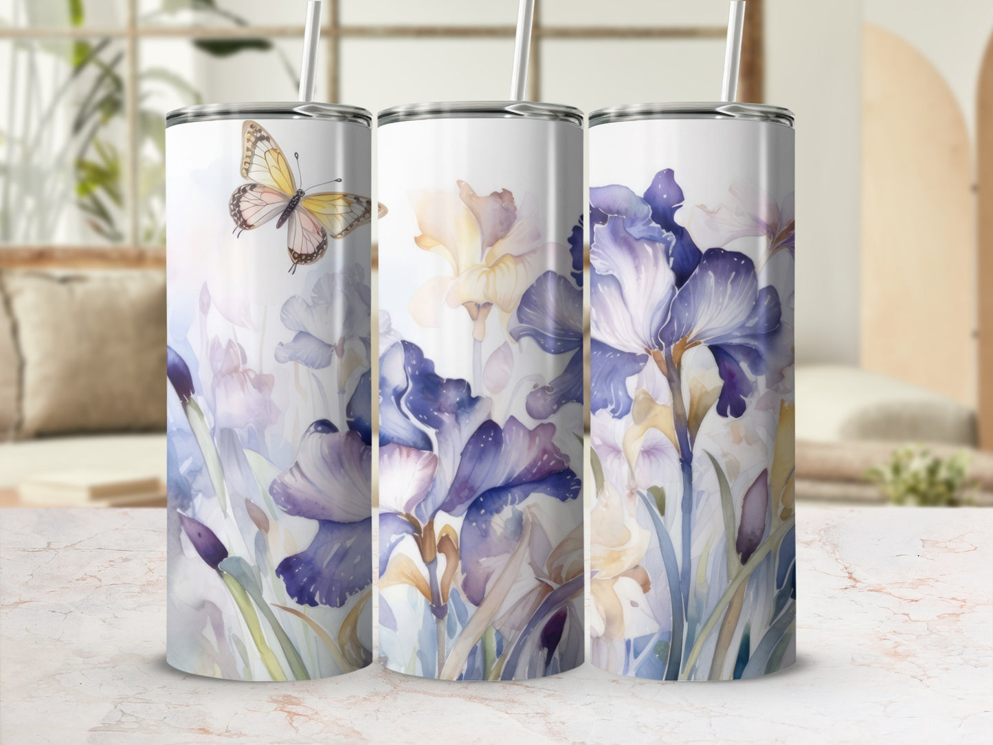 Floral watercolor design with butterflies on a set of three tumblers.
