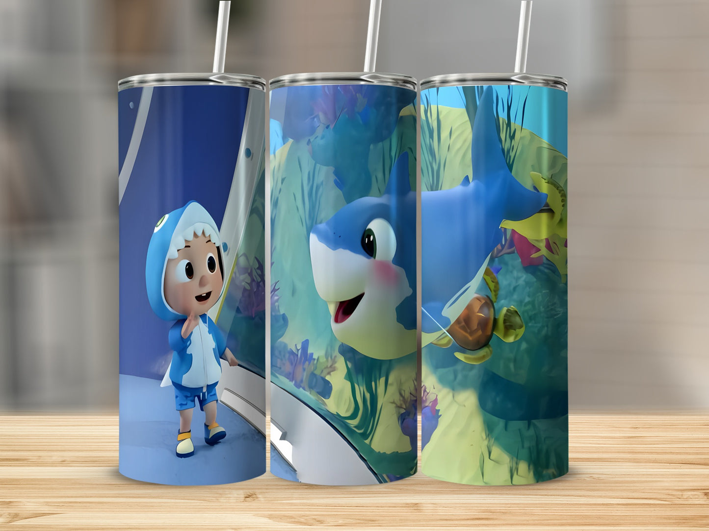 Cartoon shark and friends on a tumbler with a wooden background.