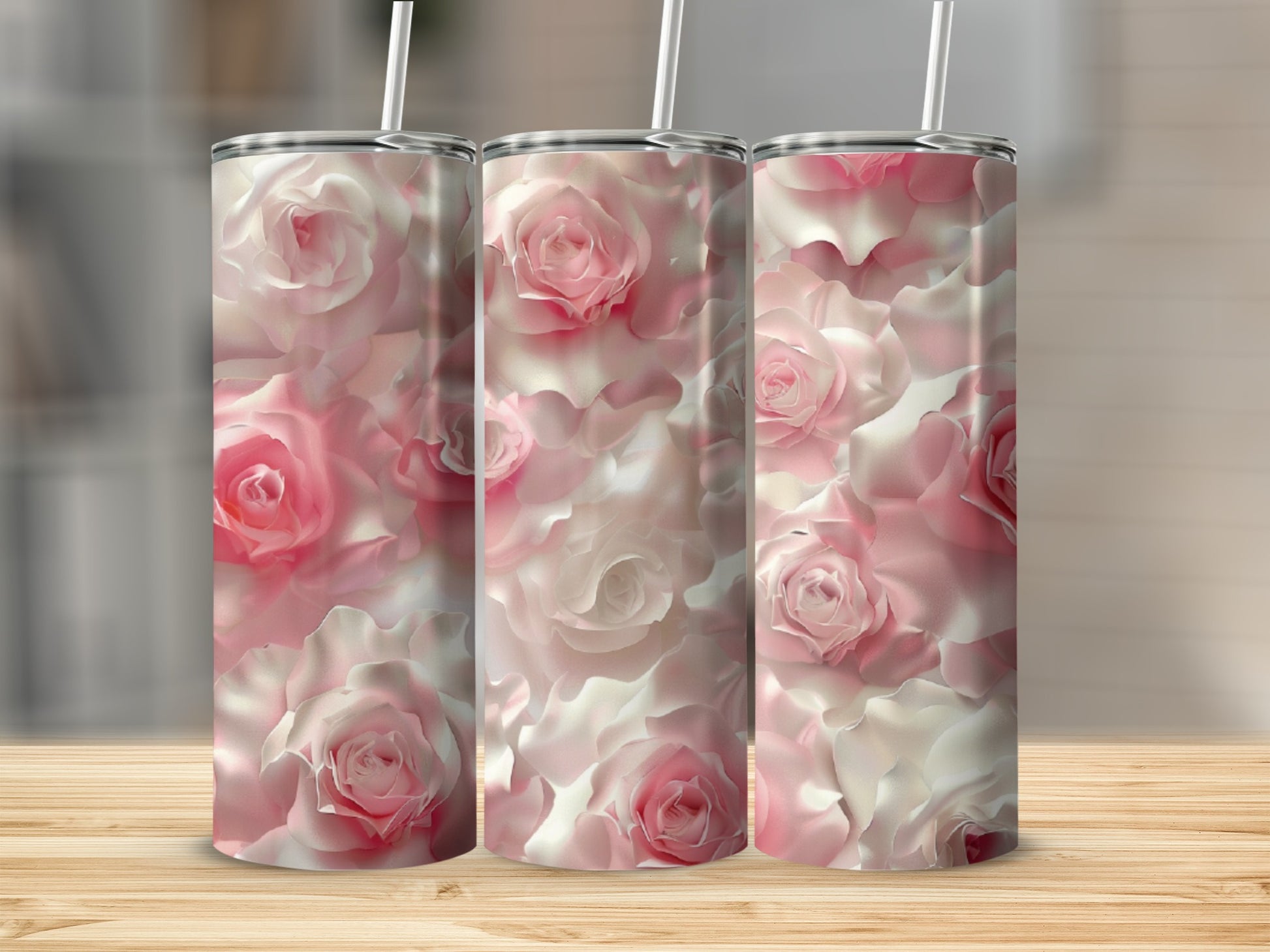 Three tumblers with a pink and white rose floral pattern.