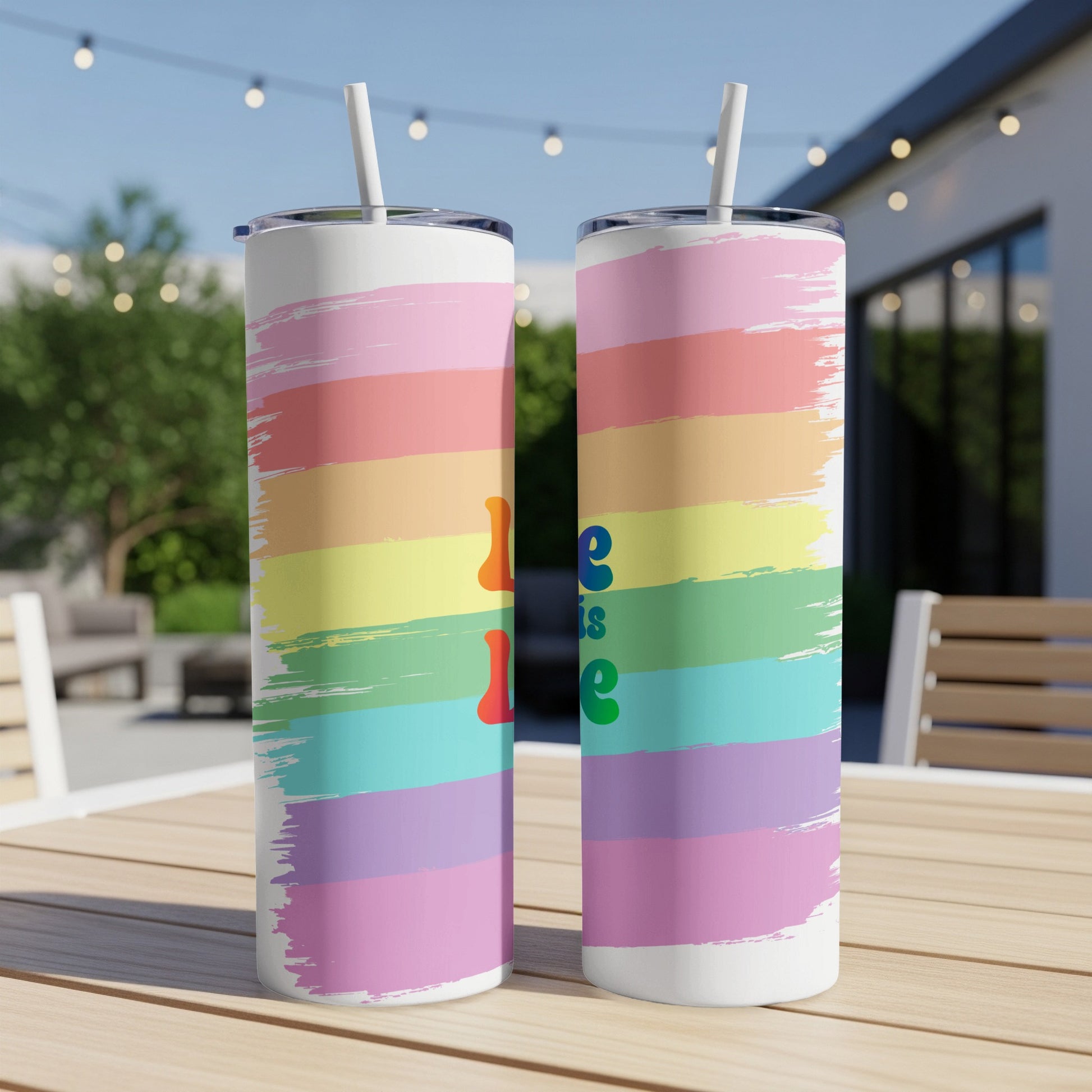 Two rainbow striped tumblers with "Love is Love" text.