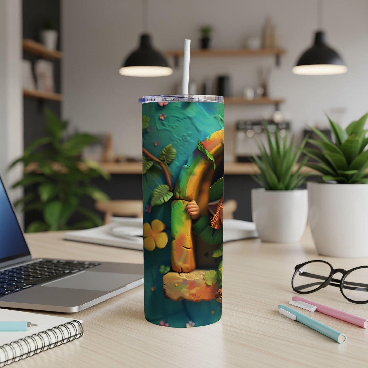 Green tumbler with a leprechaun hand and shamrock on a desk.