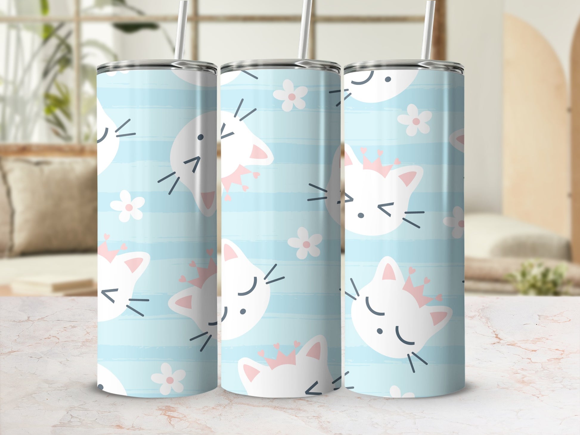 Three tumblers with a light blue striped pattern and adorable white cat faces wearing pink crowns.