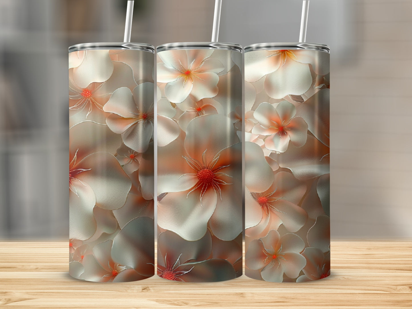 Three tumblers with a floral design featuring white and coral flowers.