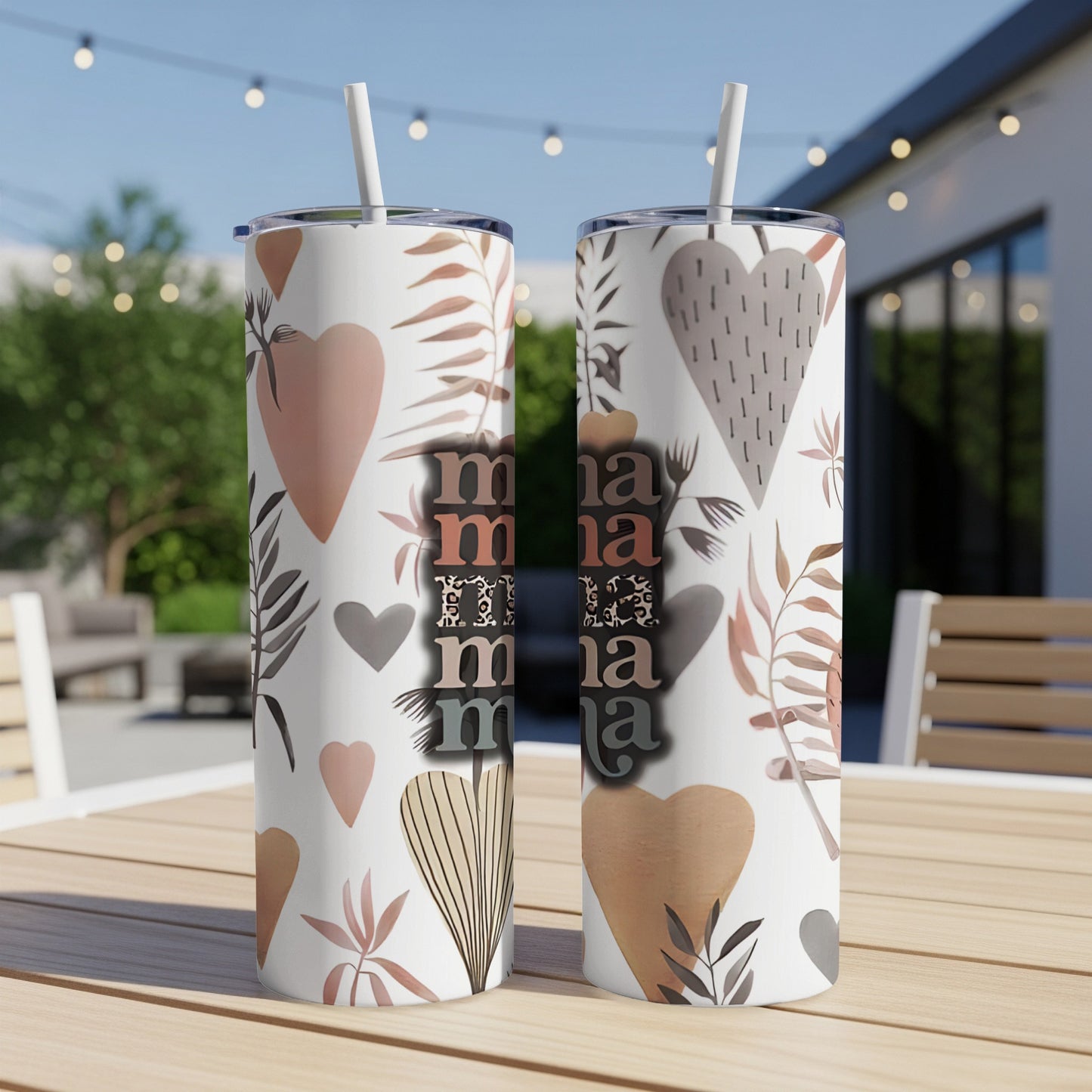 Two patterned tumblers with "mama" repeated, against a background of hearts and leaves.