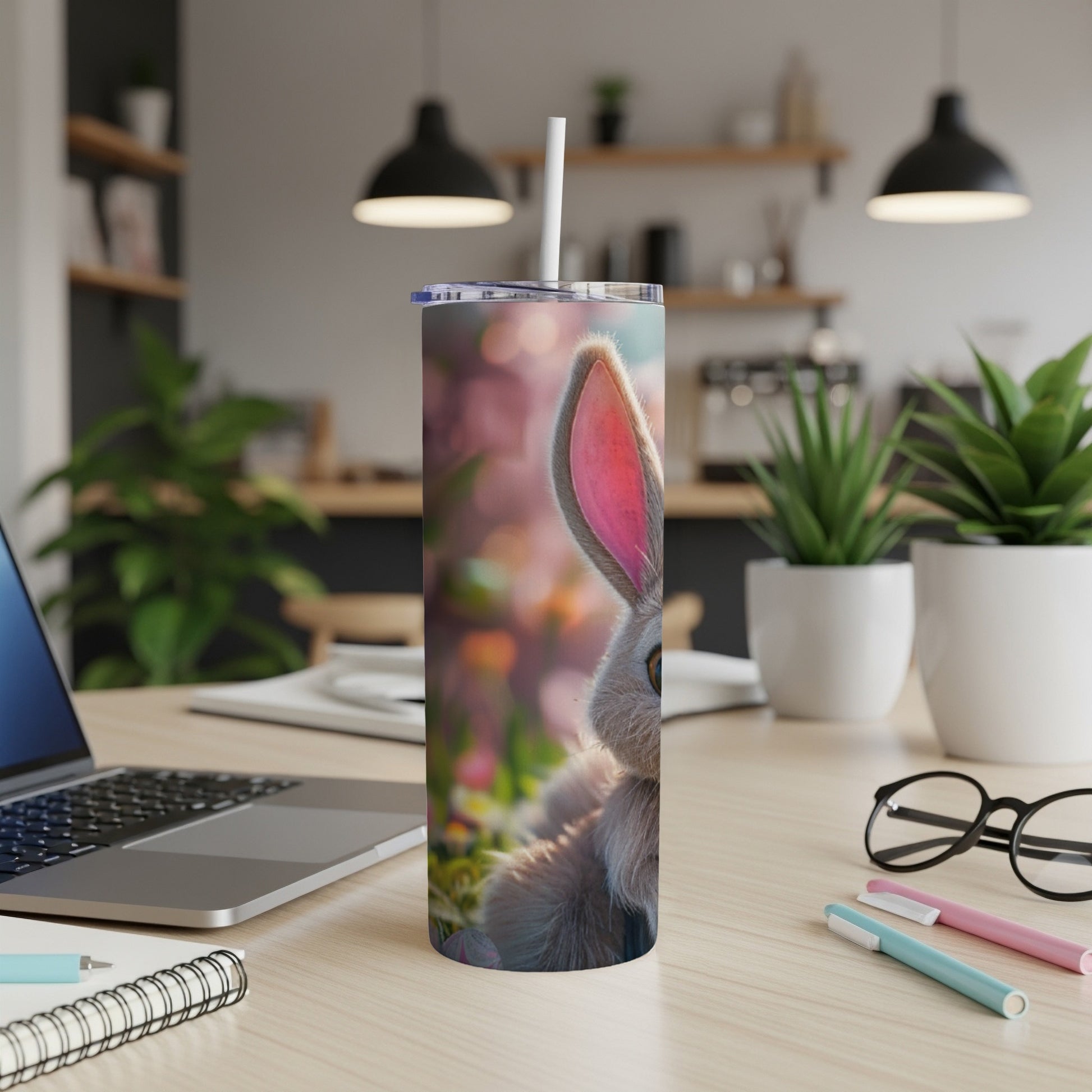Close-up of a cute bunny peeking from behind a floral background on a tumbler.