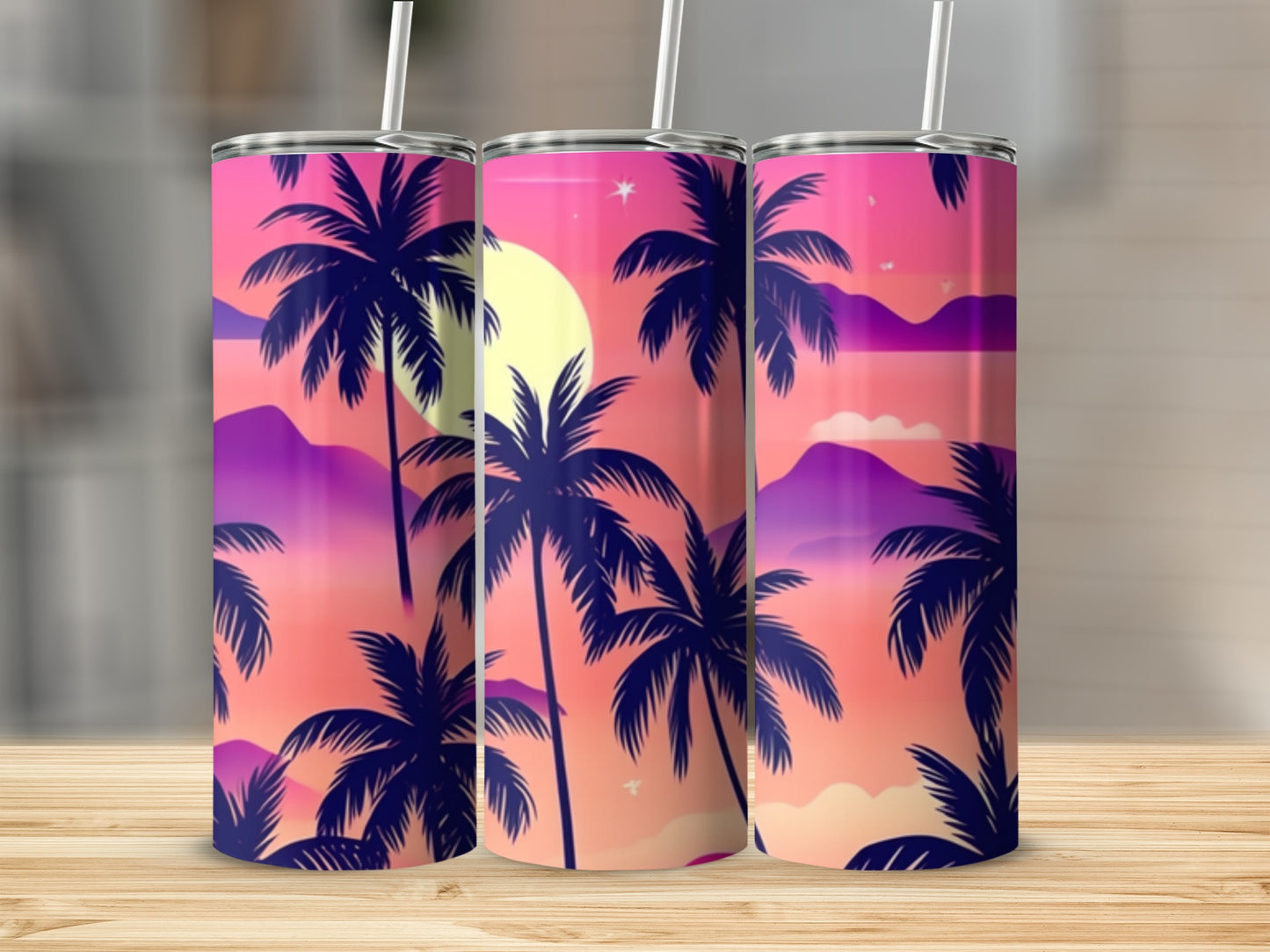 Three tumblers with a sunset palm tree design.