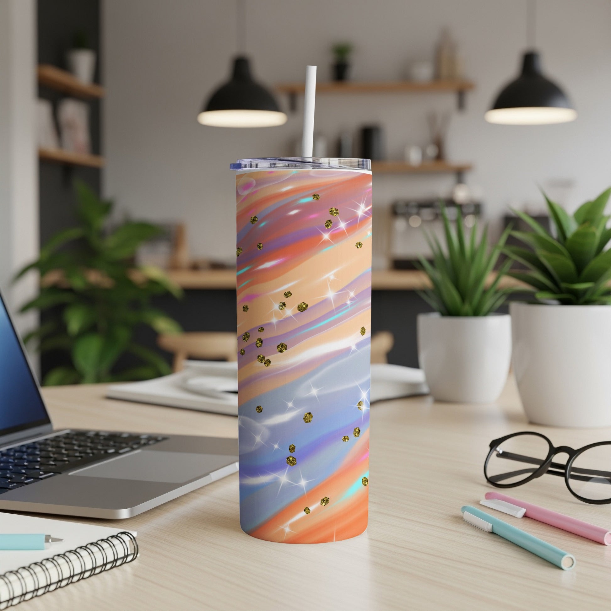 Tall tumbler with colorful swirled pattern and gold glitter accents.