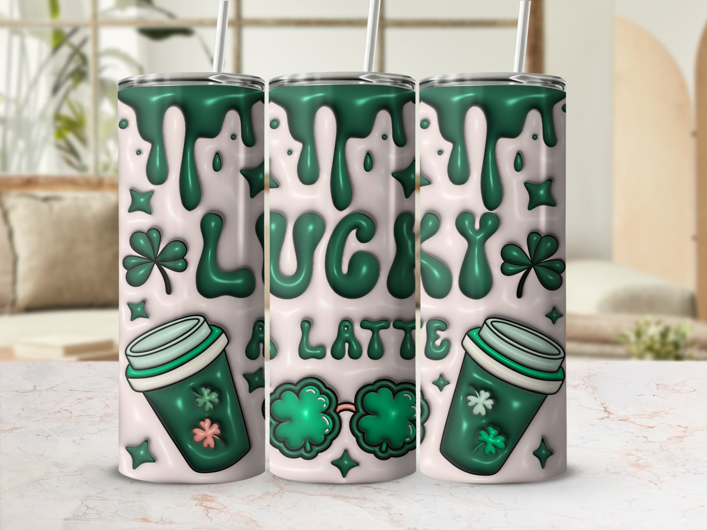 Green lucky latte design on three tumblers with shamrocks and drips.
