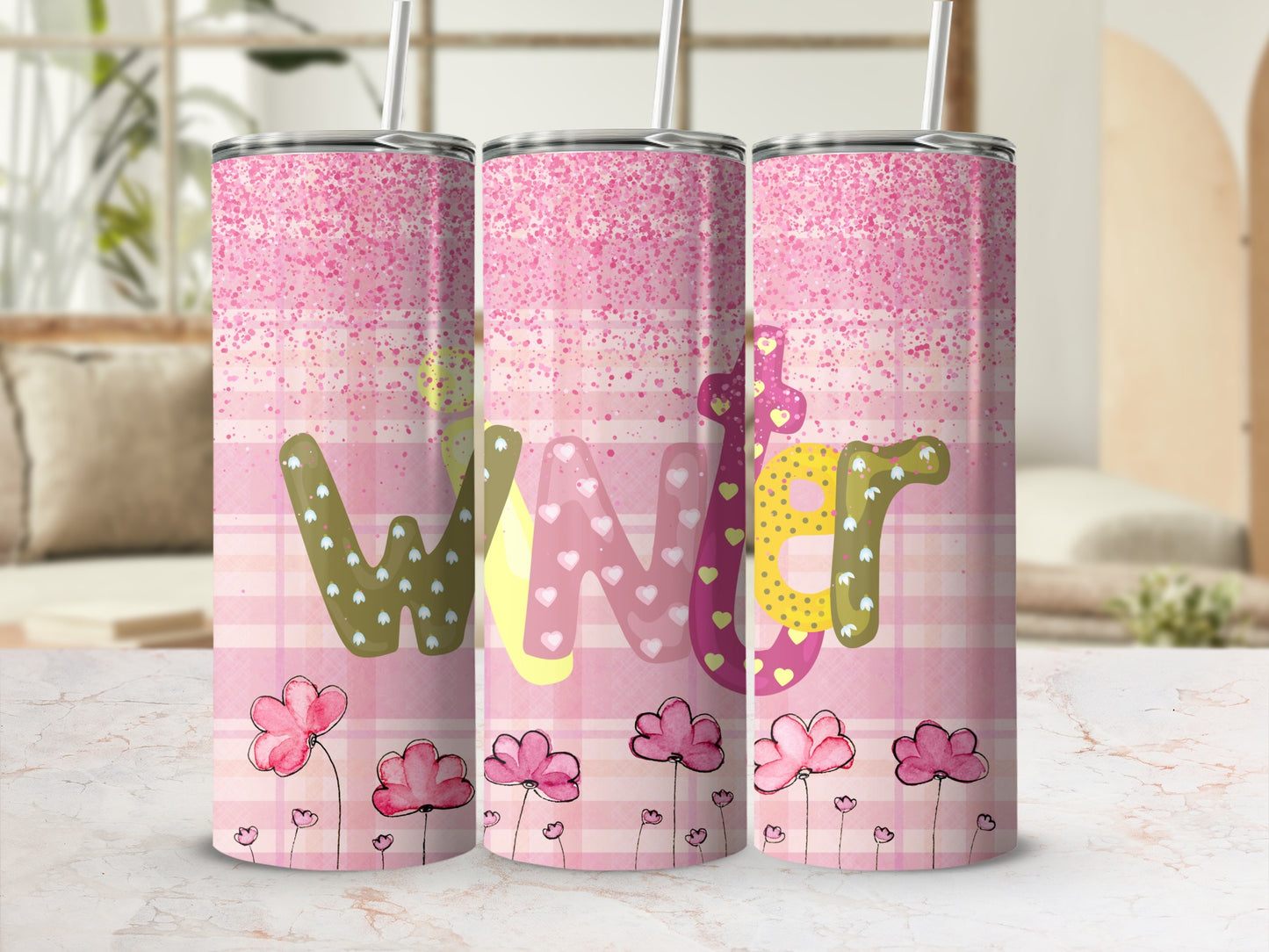 Tumbler with pink plaid, glitter, and "WINTER" text with flowers.