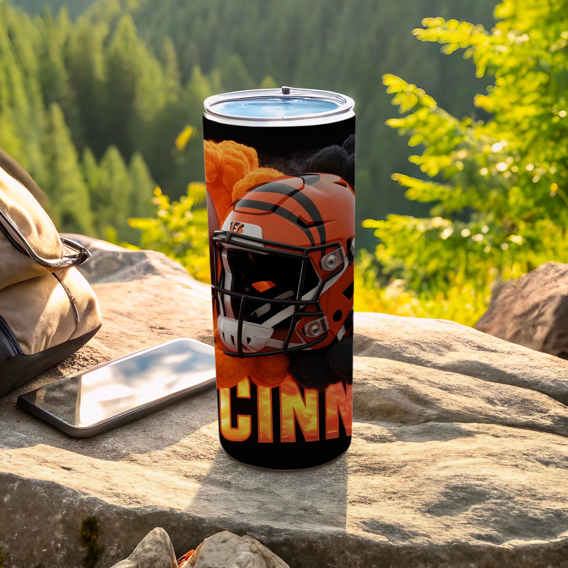 Cincinnati Bengals helmet and "CINNATI" text on a black tumbler.