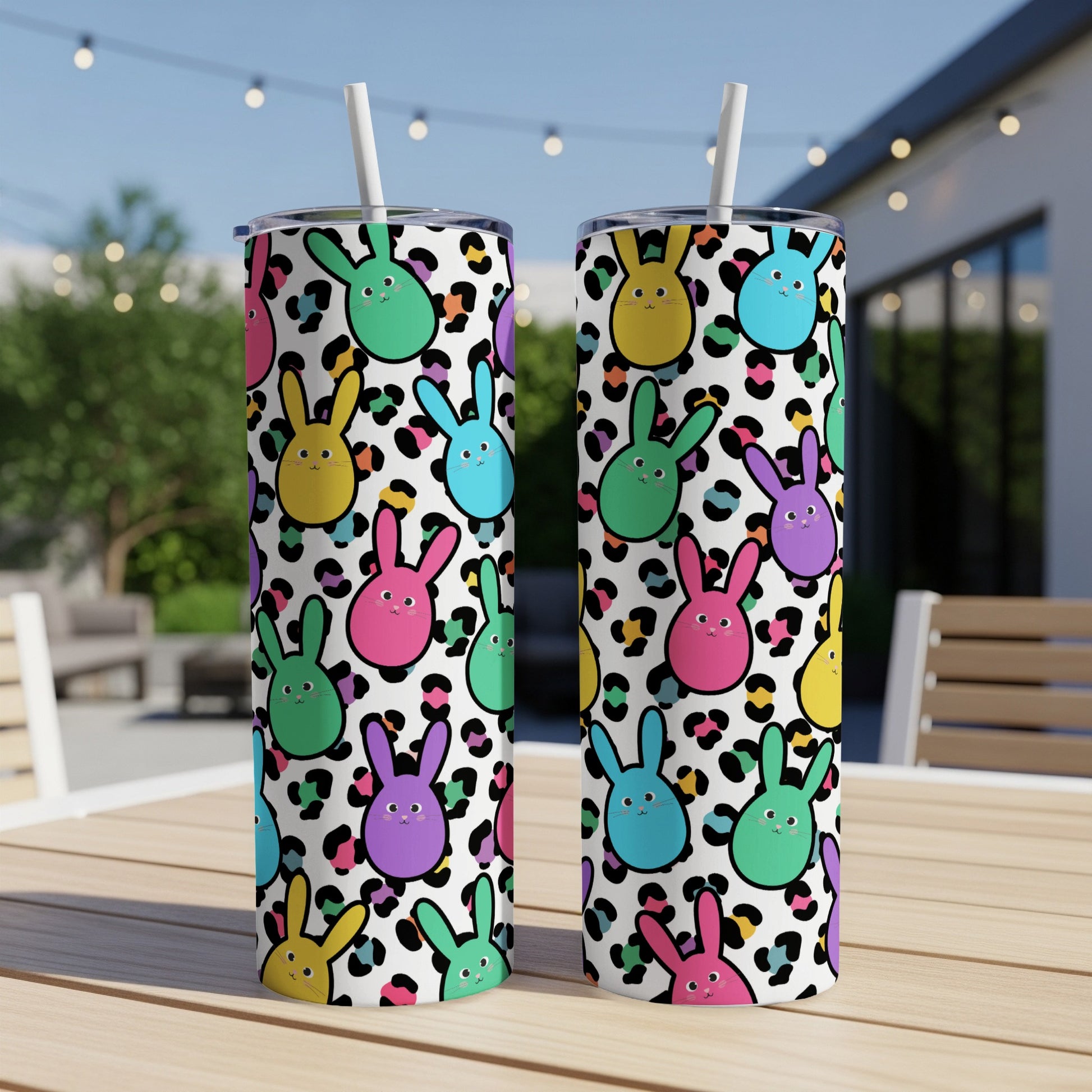 Two tumblers with a colorful bunny and leopard print design.